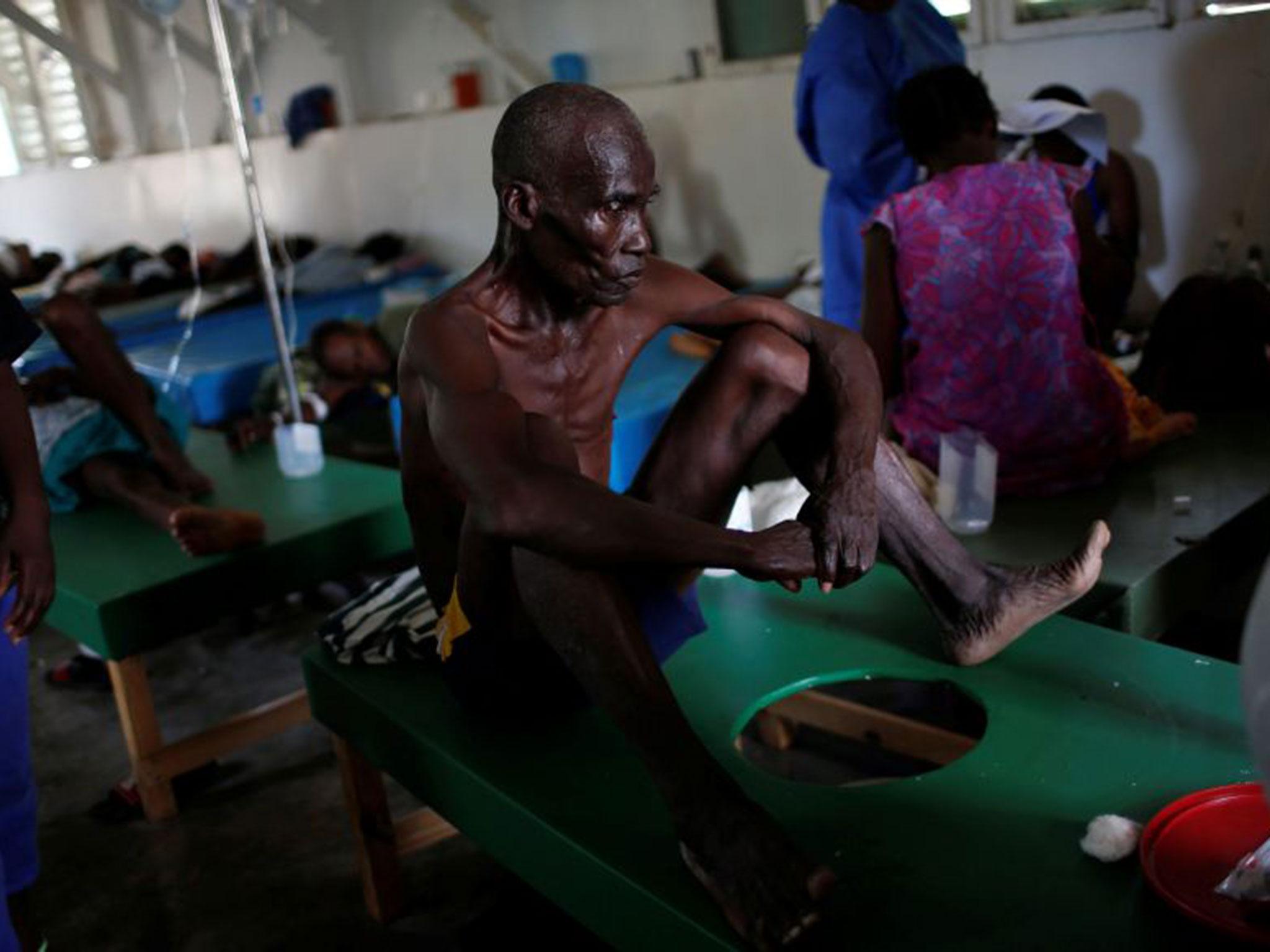 A man is treated at a cholera clinic in Jeremie, Haiti, following Hurricane Matthew