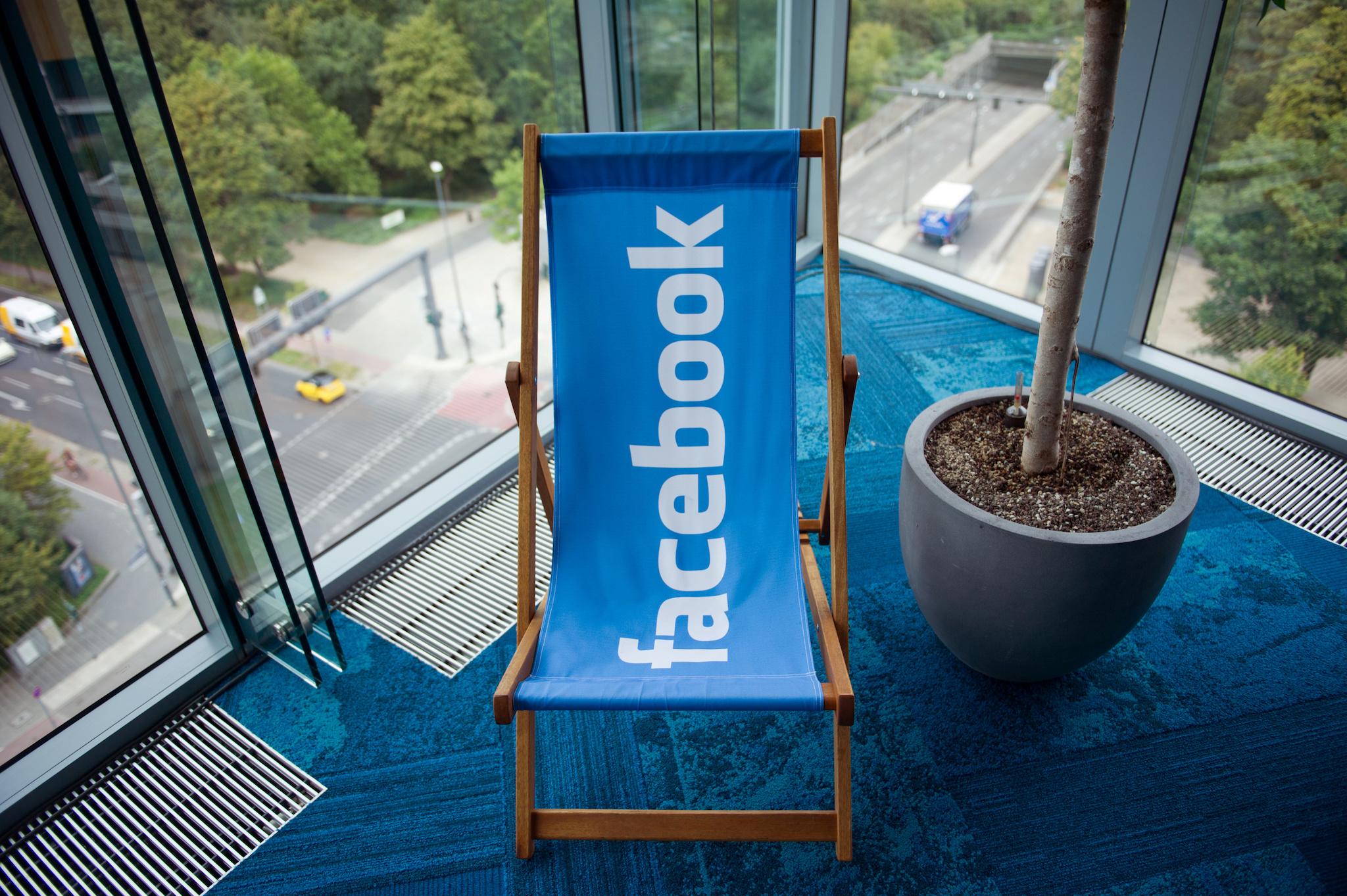 A picture shows the Facebook logo on a beach chair at the Facebook office in Berlin, Germany