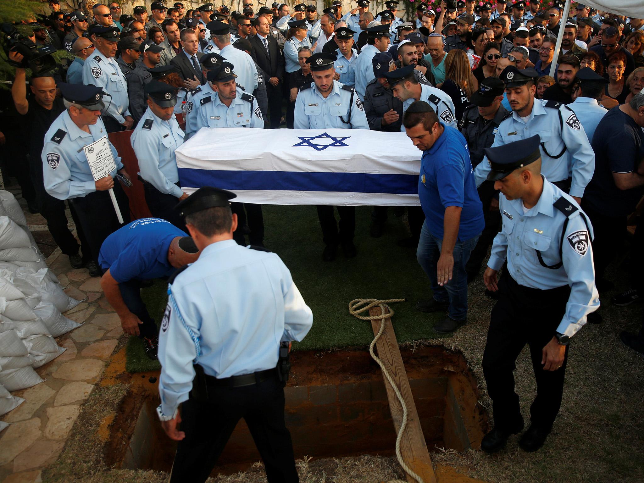 Israeli policeman Yosef Kirma was given a public funeral after being killed by a Palestinian assailant who fired from a car in East Jerusalem, leaving two dead and five injured