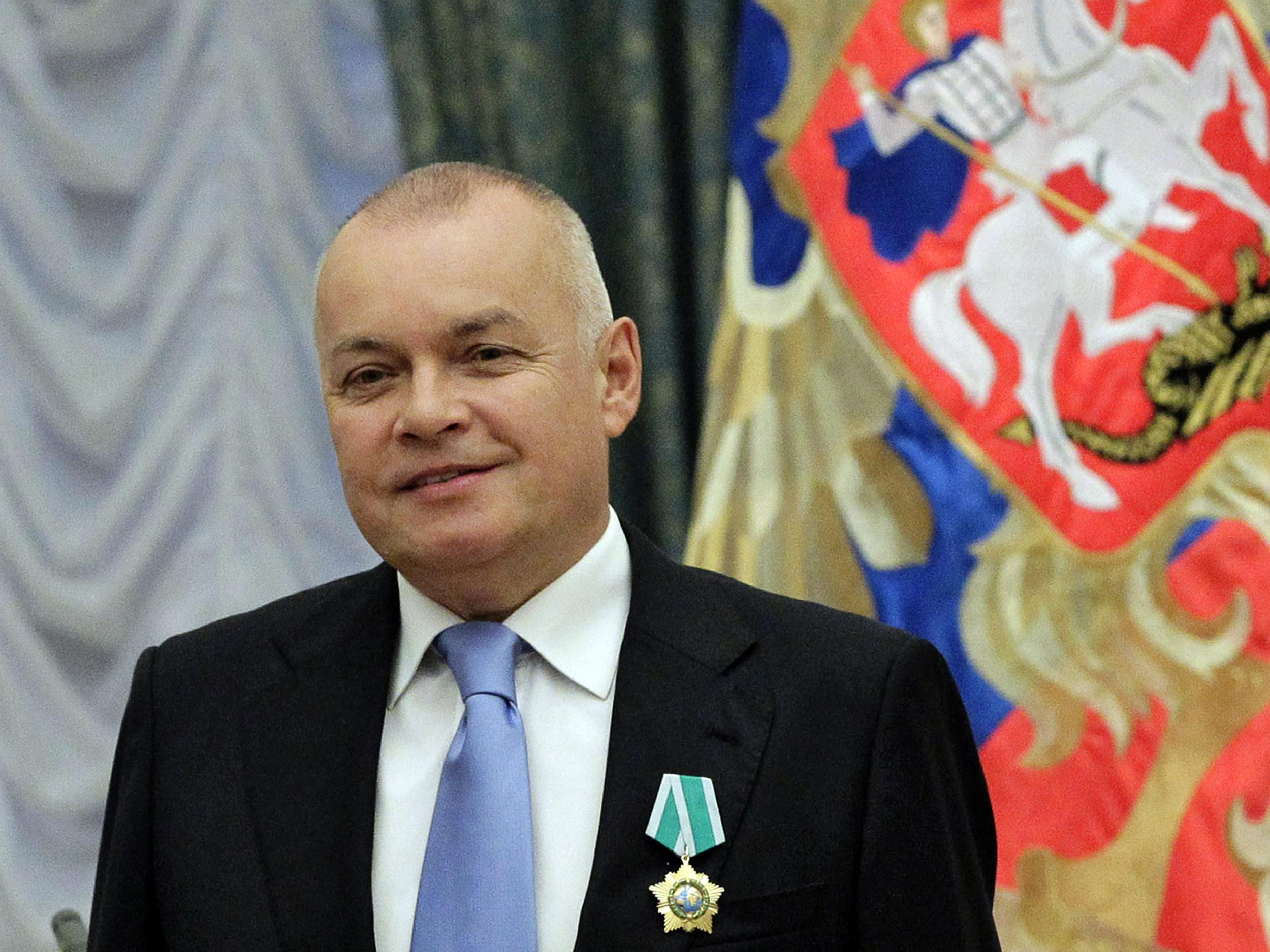 Russian television journalist Dmitry Kiselyov posing for a photo after receiving a medal of Friendship during an awarding ceremony in the Kremlin in Moscow