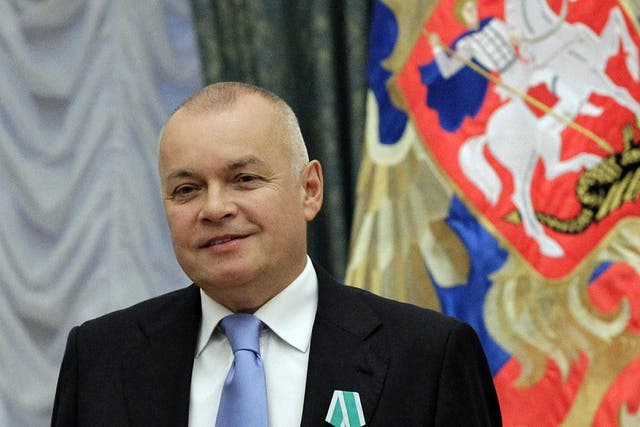 Russian television journalist Dmitry Kiselyov posing for a photo after receiving a medal of Friendship during an awarding ceremony in the Kremlin in Moscow