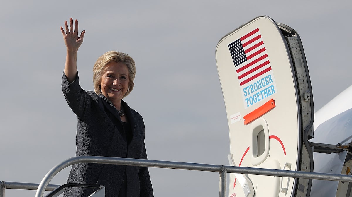 Hillary Clinton waves before boarding her campaign plane at Reagan National Airport on September 16, 2016 in Arlington, Virginia.