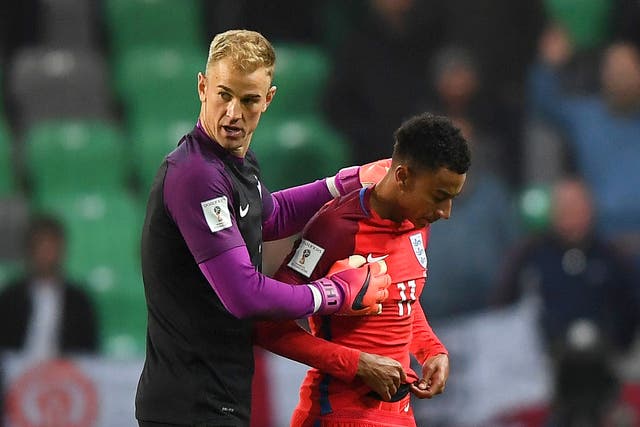 Hart walks off with Jesse Lingard after the game