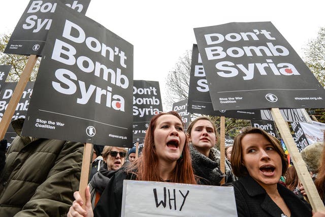 Anti-war protesters chant 'Don't bomb Syria' outside Downing Street against the possible British involvement in the bombing of Syria at Downing Street on 28 November, 2015 in London, England