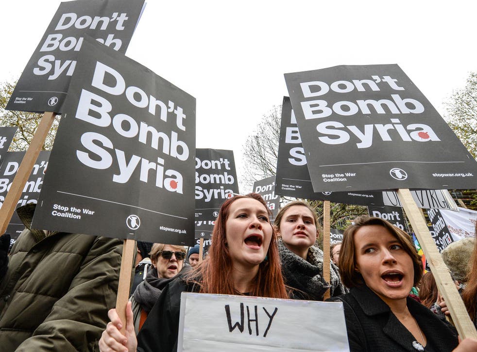 Anti-war protesters chant 'Don't bomb Syria' outside Downing Street against the possible British involvement in the bombing of Syria at Downing Street on 28 November, 2015 in London, England
