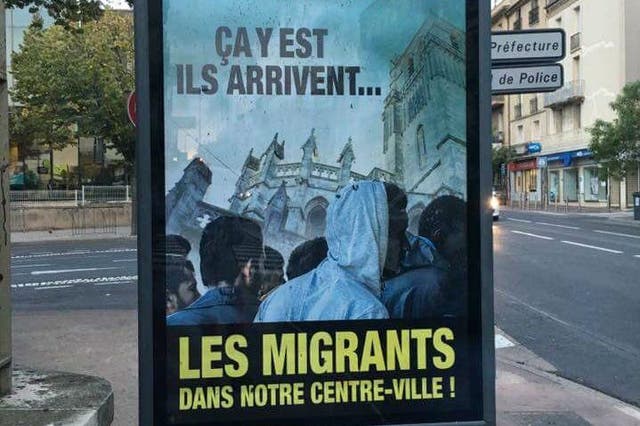 The poster reads: 'The state is imposing them on us. This is it, they are coming' above the emboldened words: 'Migrants in our town centre!'