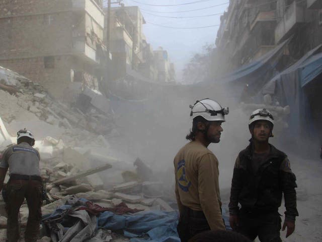 Syrian Civil Defence workers search through rubble in rebel-held eastern Aleppo