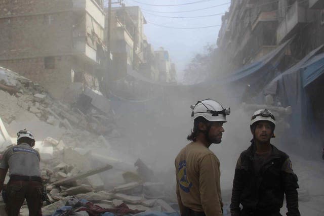 Syrian Civil Defence workers search through rubble in rebel-held eastern Aleppo