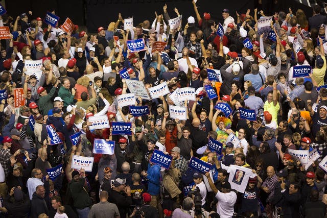 Supporters face the cameras and chant at a campaign rally for Donald Trump in Wilkes-Barre, Pennsylvania