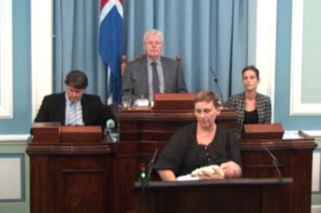 Independence Party MP Unnur Brá Konráðsdóttir breastfeeds her baby at the podium