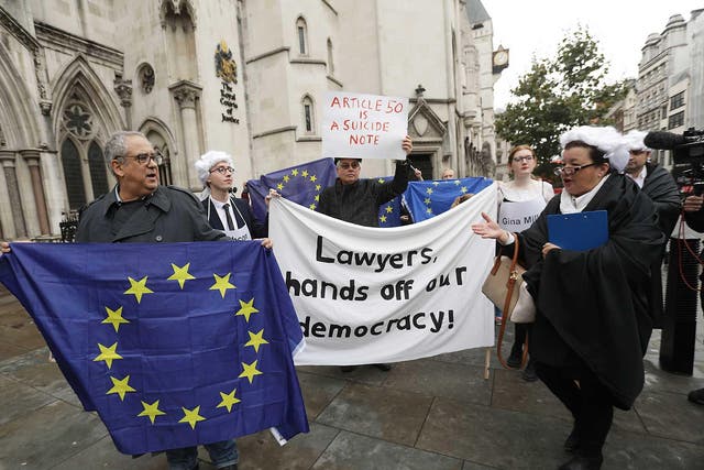 Protesters outside the High Court in London