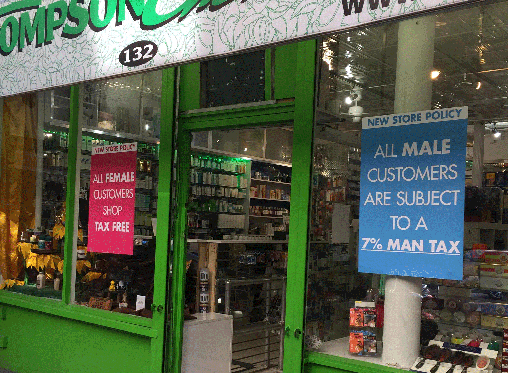 A sign outlining the 'man tax' policy at Thompson's chemists in Soho, Manhattan