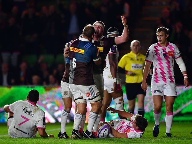 James Chisholm celebrates after scoring his side's fourth try during the European Rugby Challenge Cup match between Harlequins and Stade Francais Paris at Twickenham Stoop
