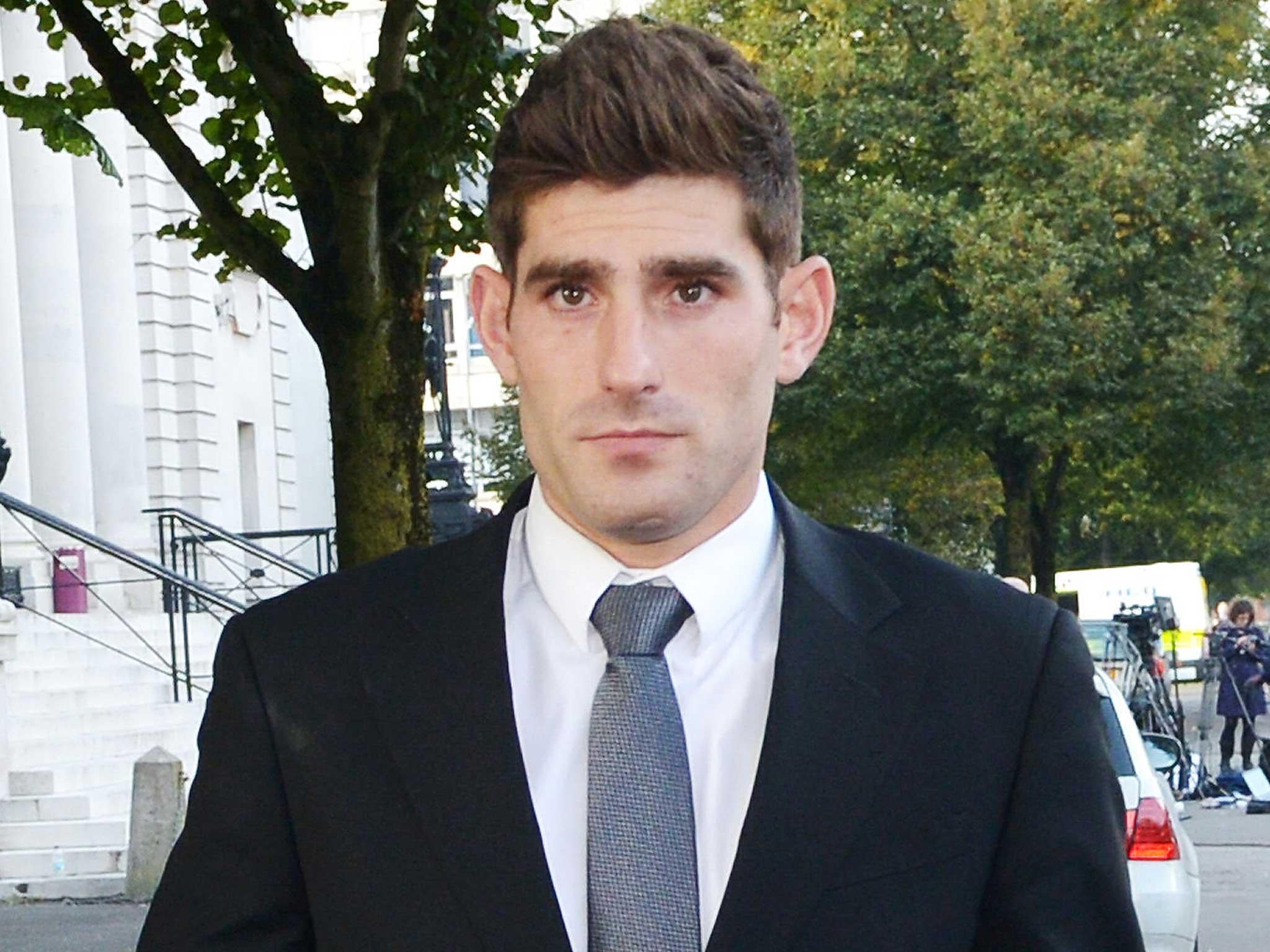 Footballer Ched Evans leaves Cardiff Crown Court, where he has been found not guilty of raping a teenager in a hotel in north Wales