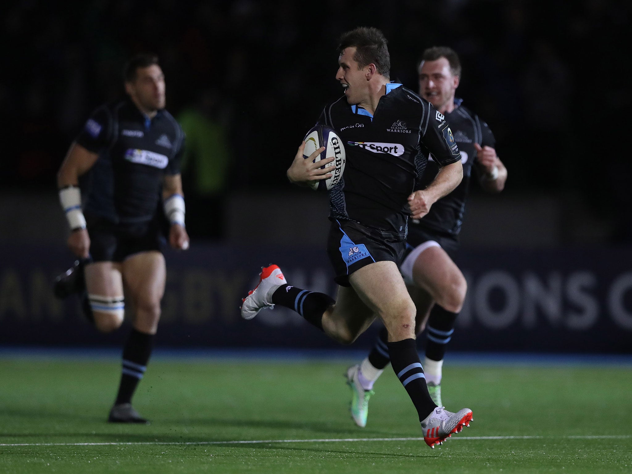 Mark Bennet of Glasgow runs in his first try during the European Rugby Champions Cup match between the Warriors and Leicester Tigers at Scotstoun Stadium