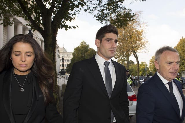 Chesterfield FC football player Ched Evans leaves Cardiff Crown Court with partner Natasha Massey after being found not guilty of rape