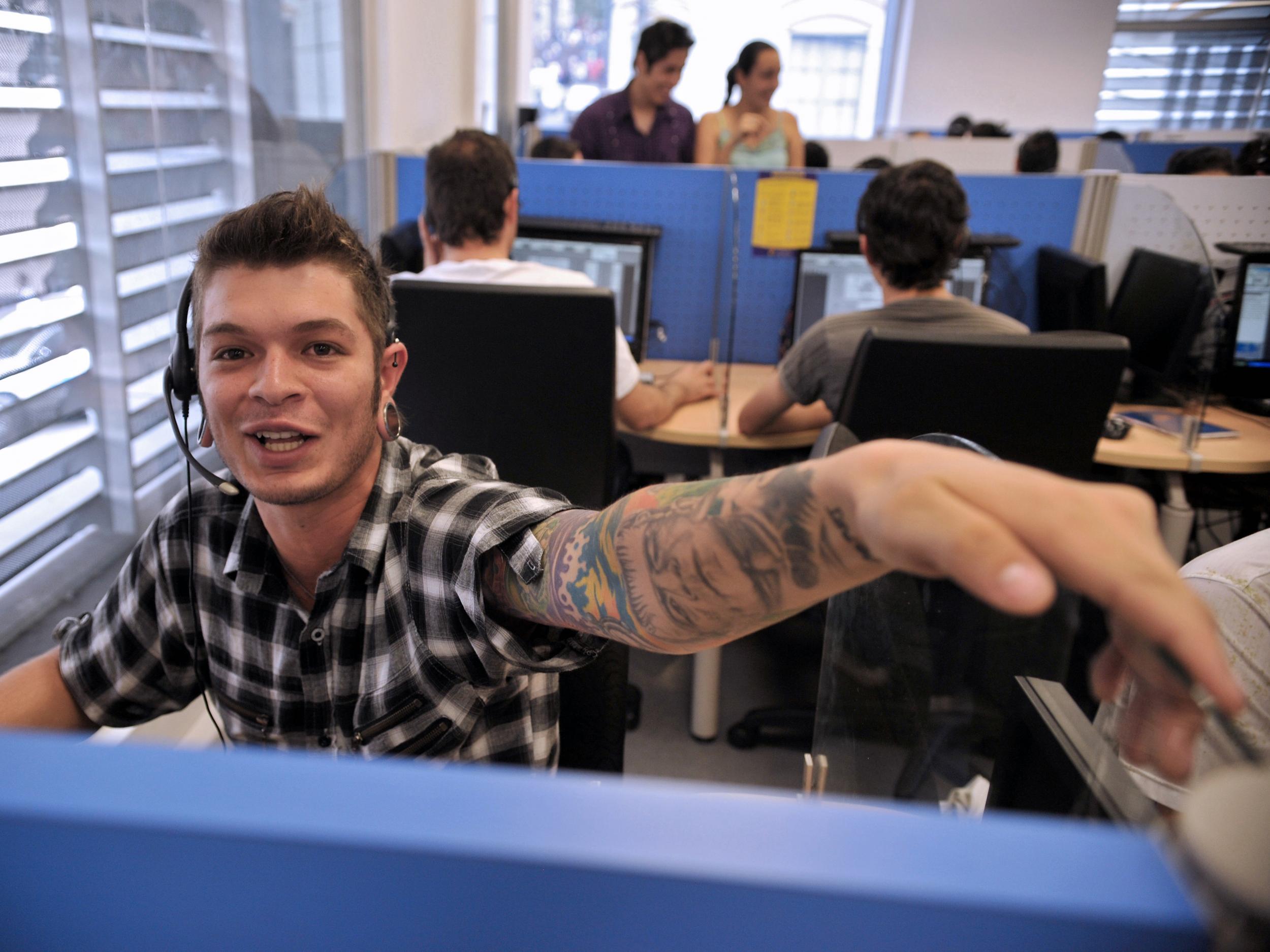 A young telemarketer works in a call center