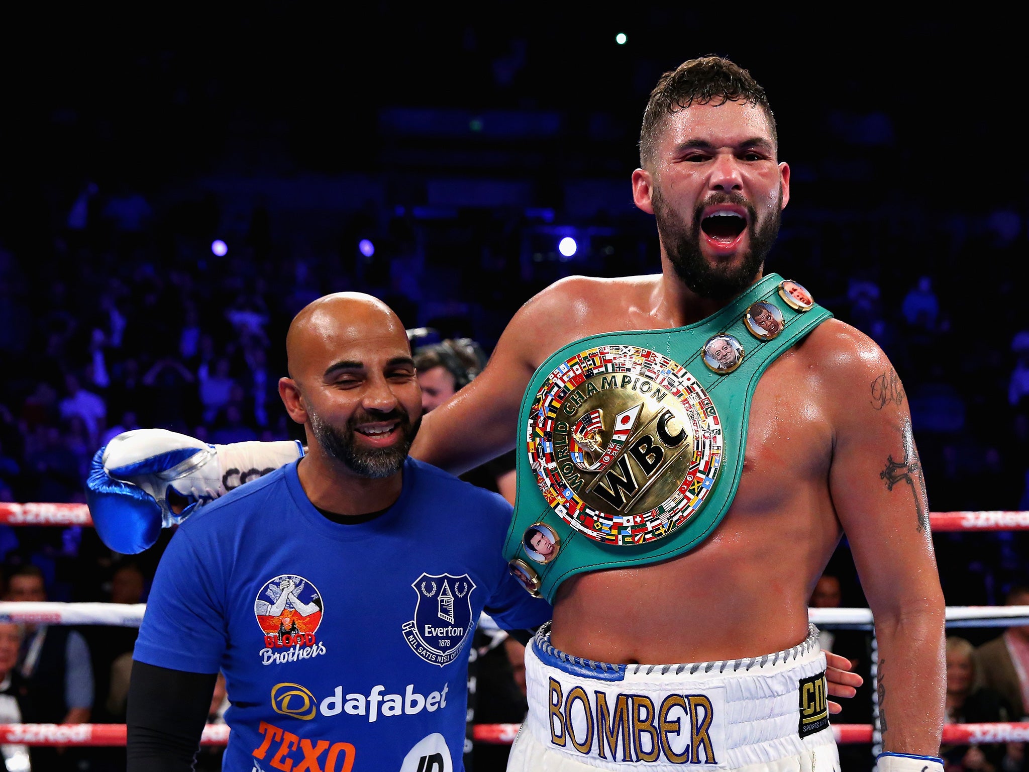 Bellew celebrates his successful defence with trainer Dave Coldwell