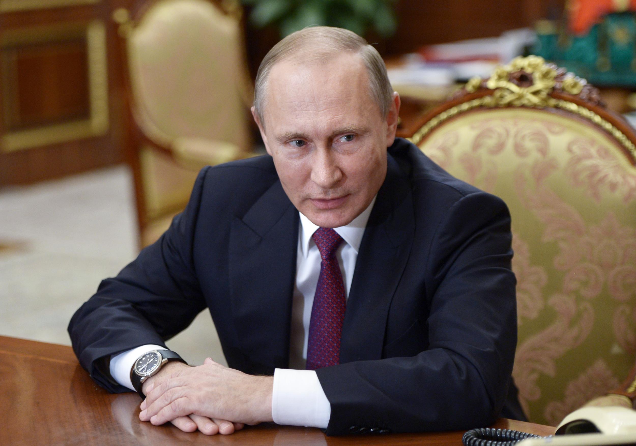 President Vladimir Putin denies Moscow is responsible for cyber attacks on US organisations