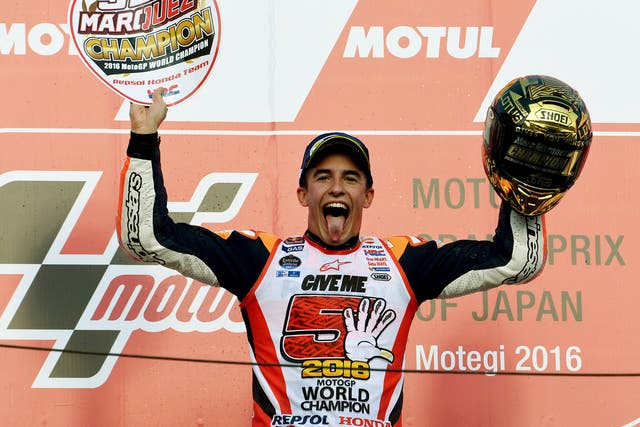 Marc Marquez celebrates winning a third MotoGP world championship