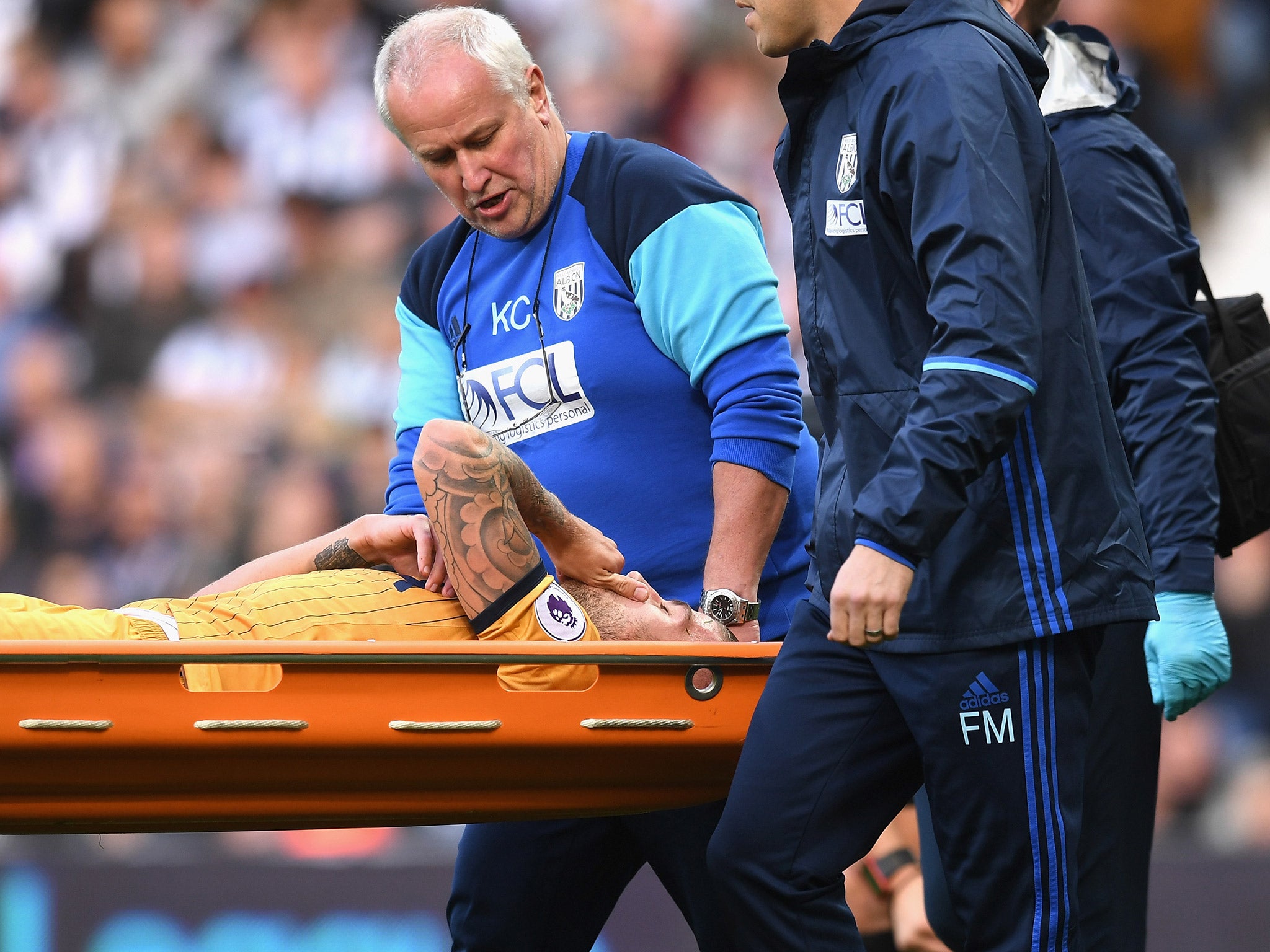 Toby Alderweireld is carried off the field on a stretcher after suffering leg and knee injuries