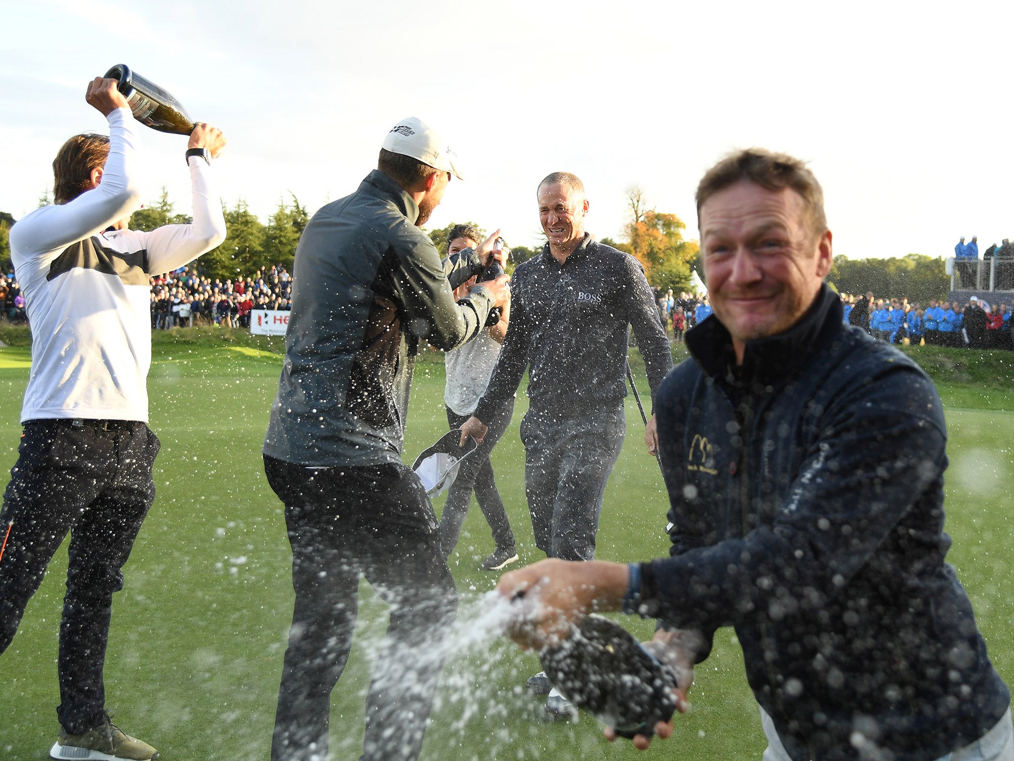 Noren celebrates as his fellow players spray him with champagne