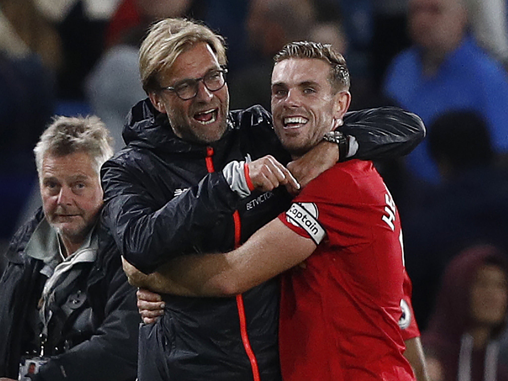 Klopp embraces Henderson after Liverpool's win at Chelsea