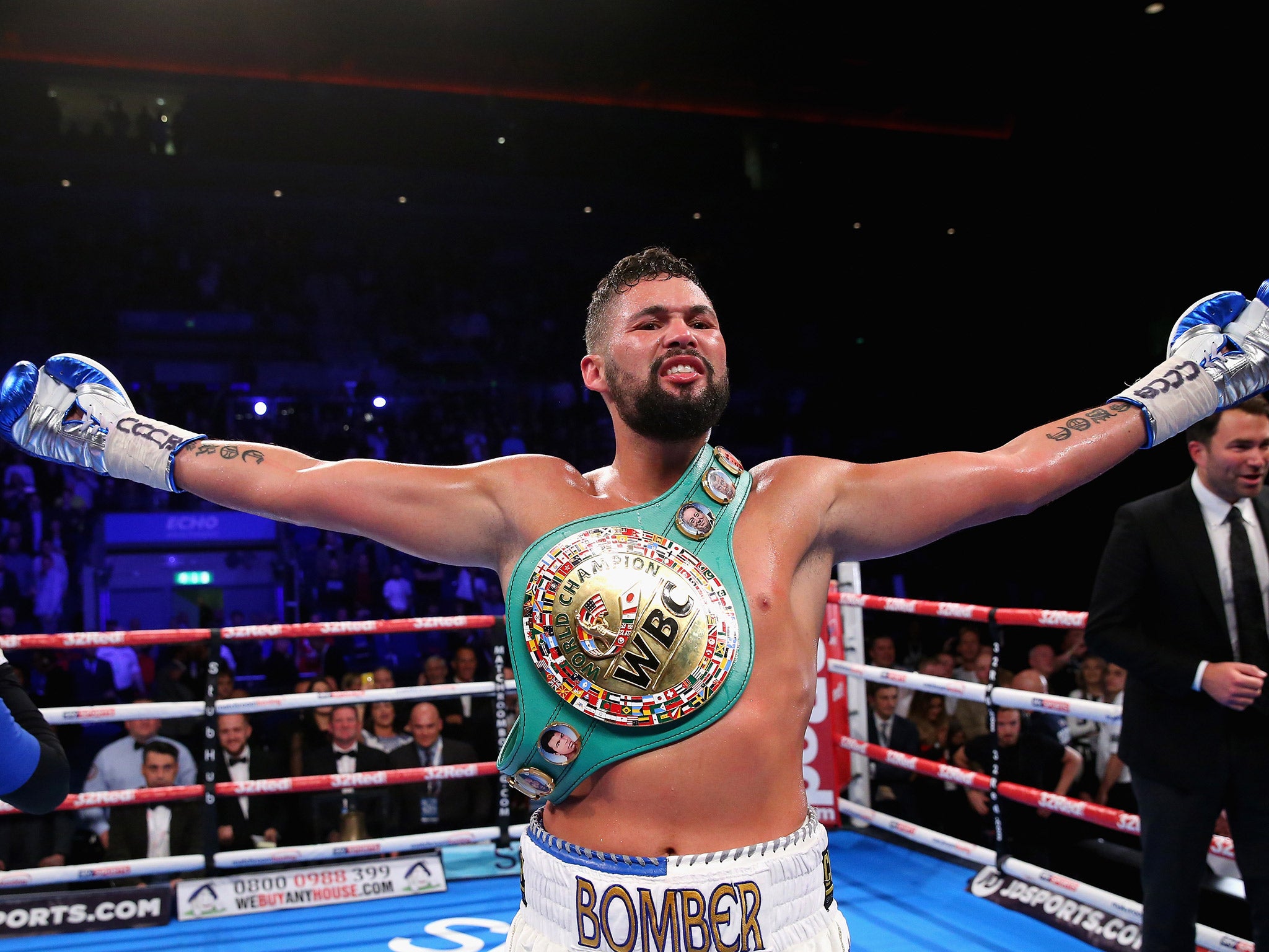 Tony Bellew celebrates his WBC cruiserweight title retention after beating BJ Flores