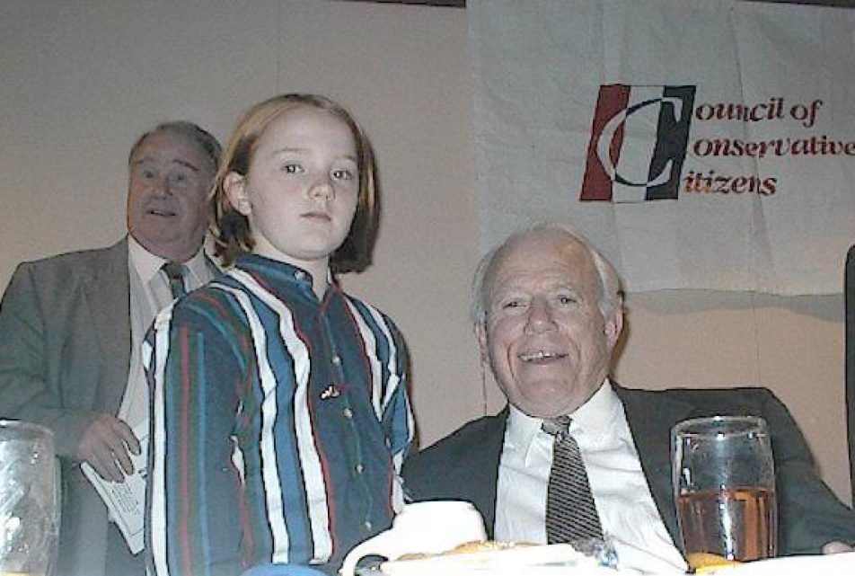 Derek Black, at age 9, at a gathering in Jackson, Miss., of the white nationalist Council of Conservative Citizens. He is pictured with then-Mississippi Gov. Kirk Fordice.