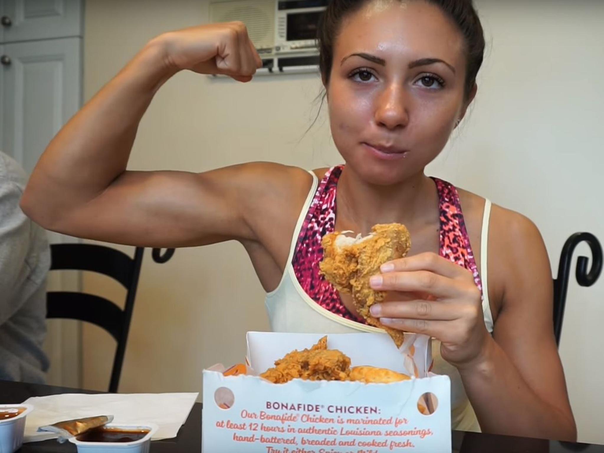 Ashley Nocera tucks into some fried chicken during her challenge