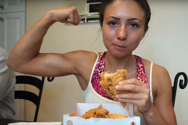 Ashley Nocera tucks into some fried chicken during her challenge
