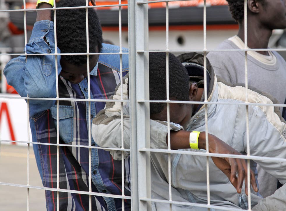 Refugees in Sicily after being rescued from a smugglers' boat in the Central Mediterranean