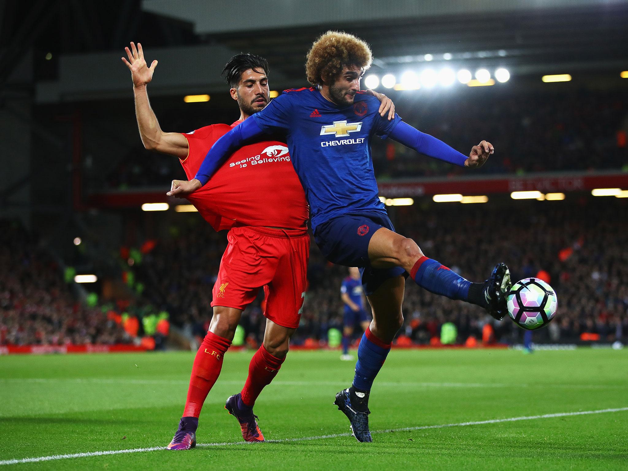 Can and Fellaini compete for the ball