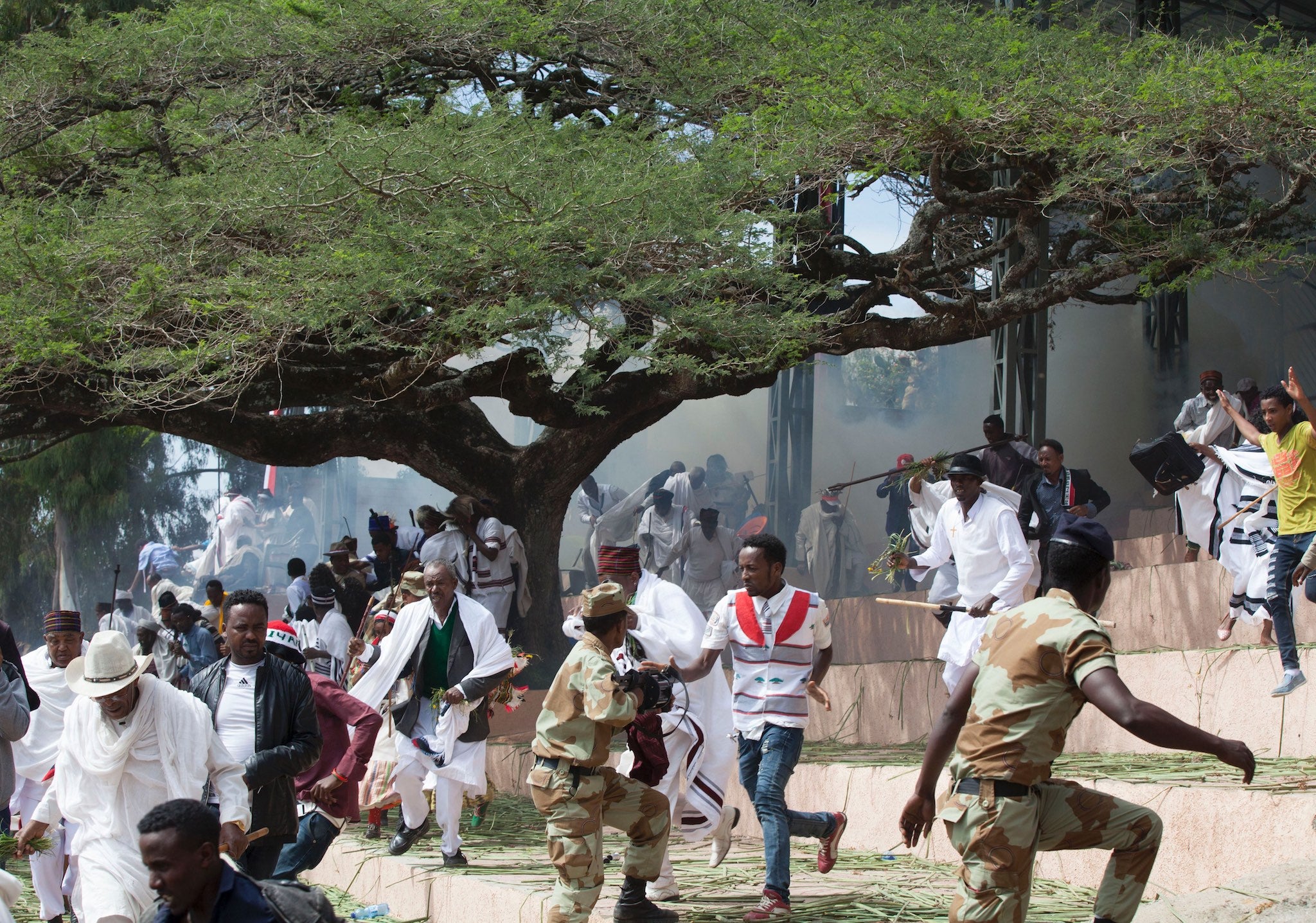 Festival goers flee during a deadly stampede in Bishoftu, on October 2, 2016