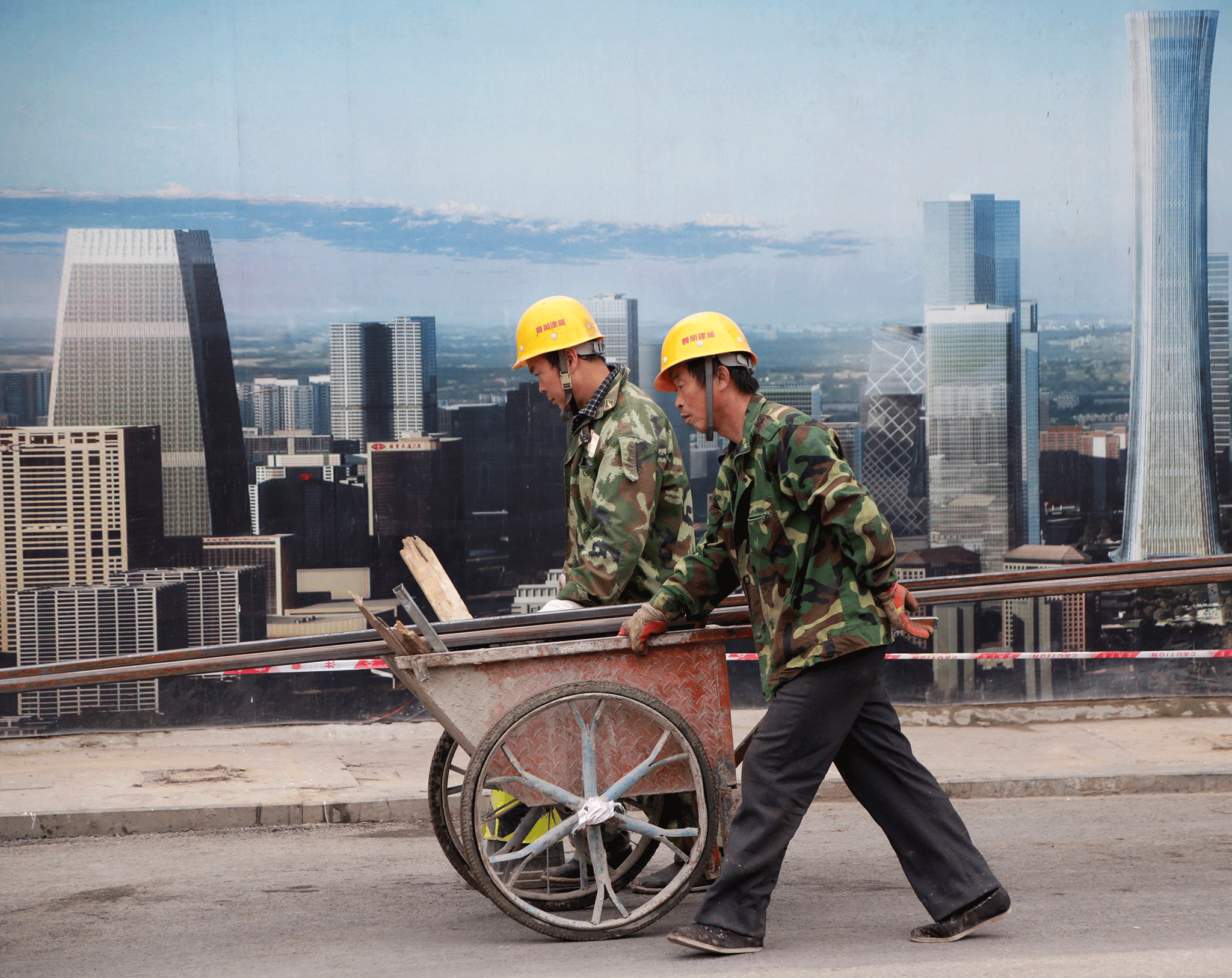 Labourers work at a construction site in Beijing - experts say unsustainable building boom is fueling growth