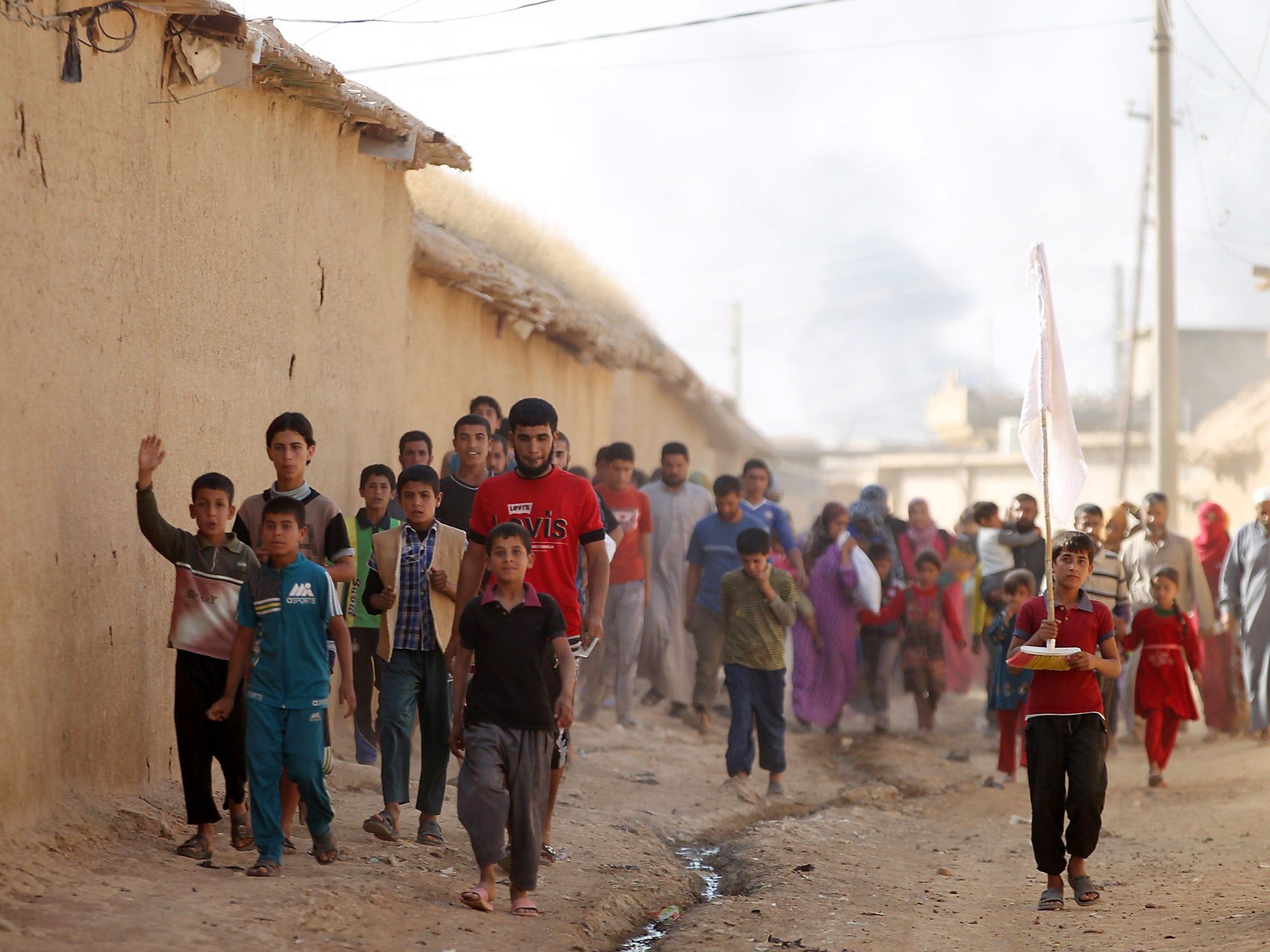 Displaced Iraqis from a village outside Mosul, who fled fighting in the area