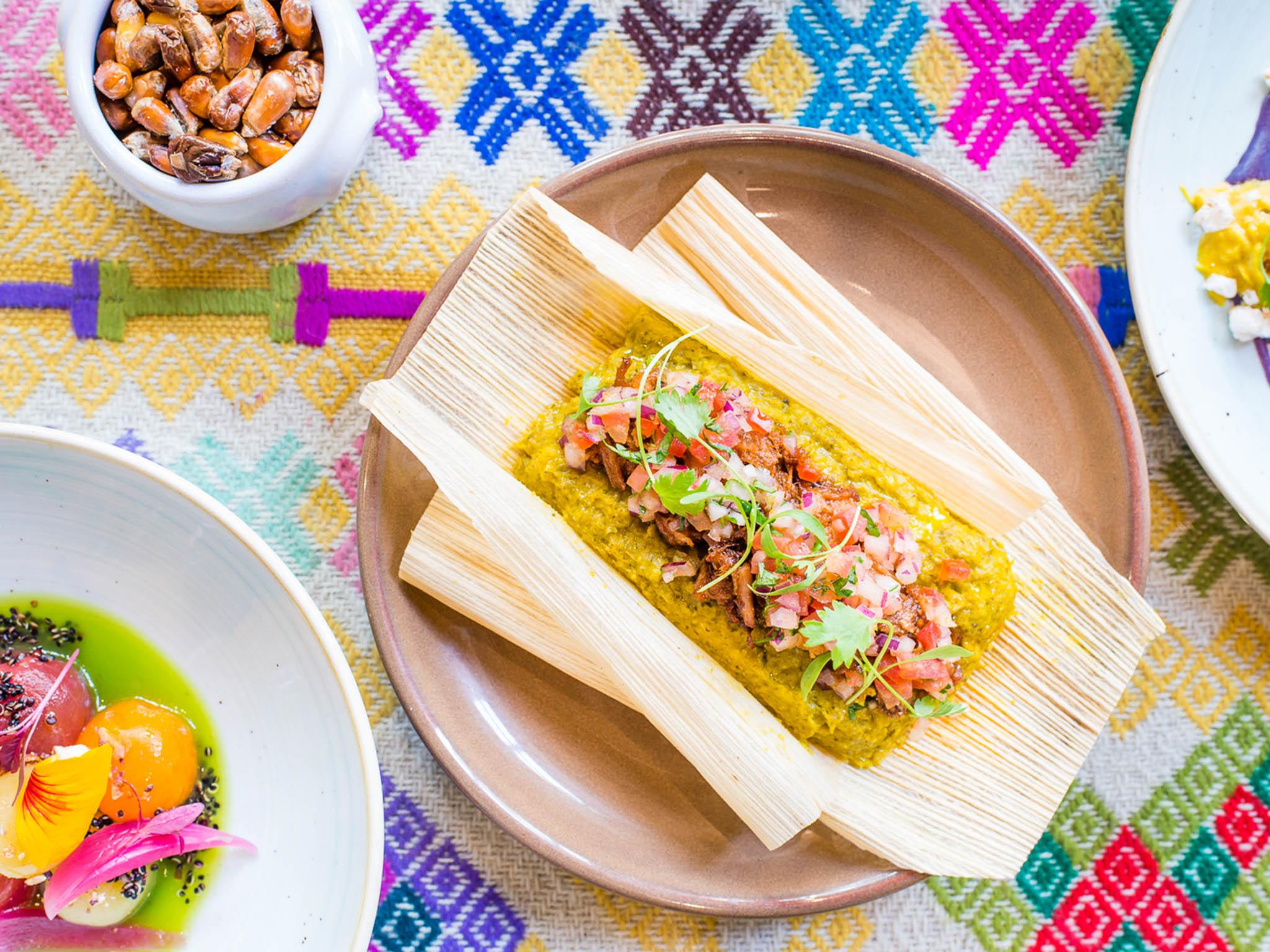 &#13; Tamal – pork in a corn dumpling, coriander, onions and tomatoes (Paul Winch Furness)&#13;