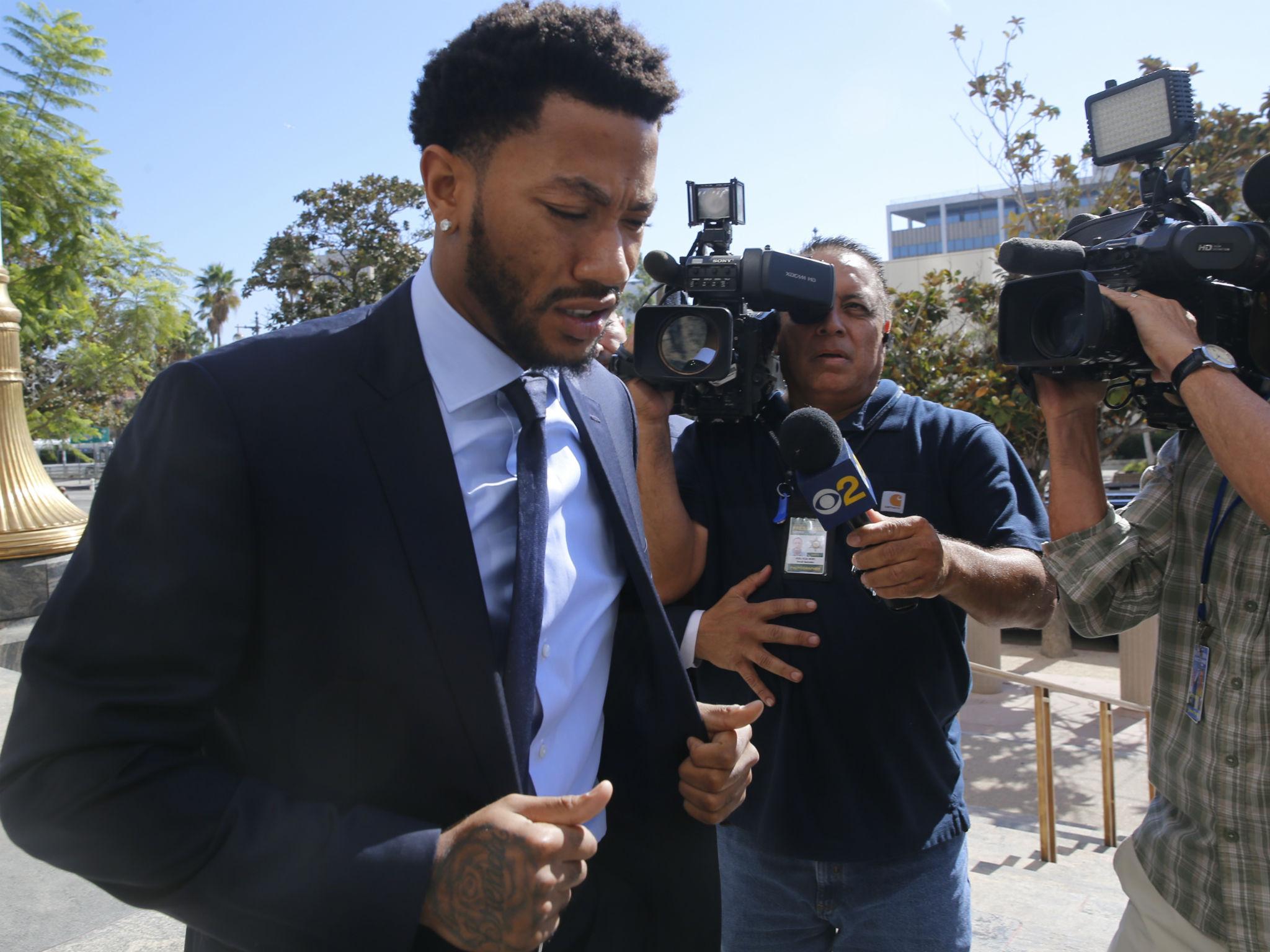 Rose enters the LA court room in October