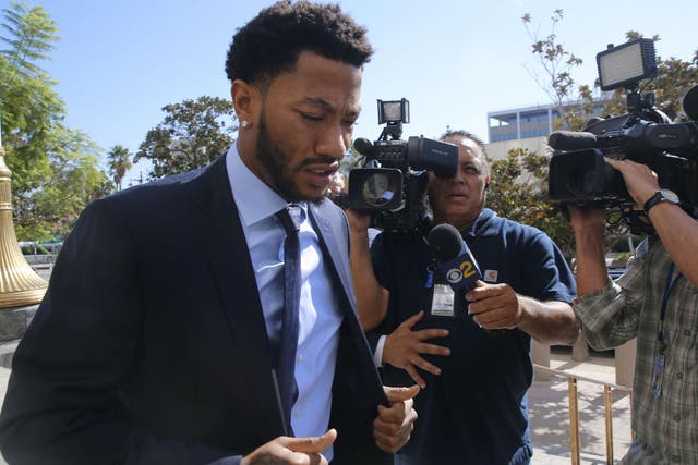 Rose enters the LA court room in October
