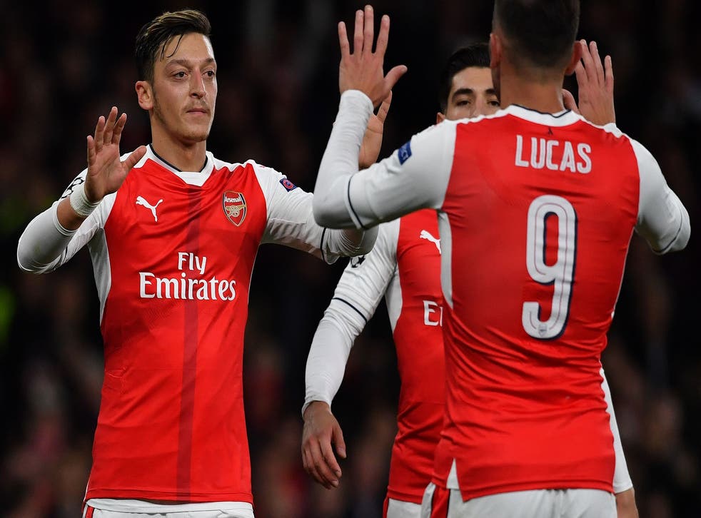 Mesut Özil celebrates his second goal with Lucas Perez to put Arsenal 5-0 up