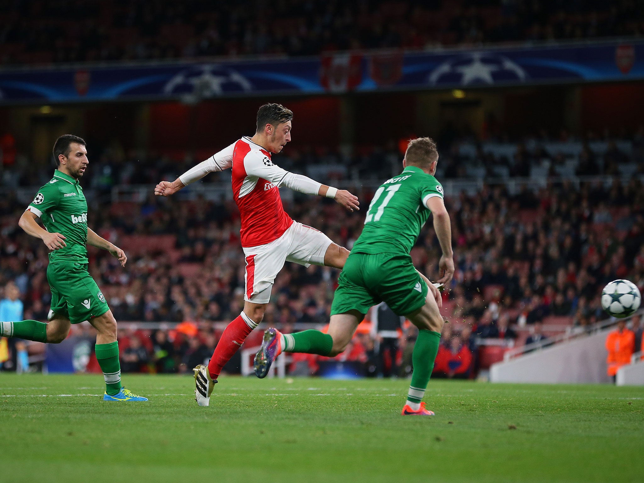 Mesut Ozil volleys home his third goal at The Emirates