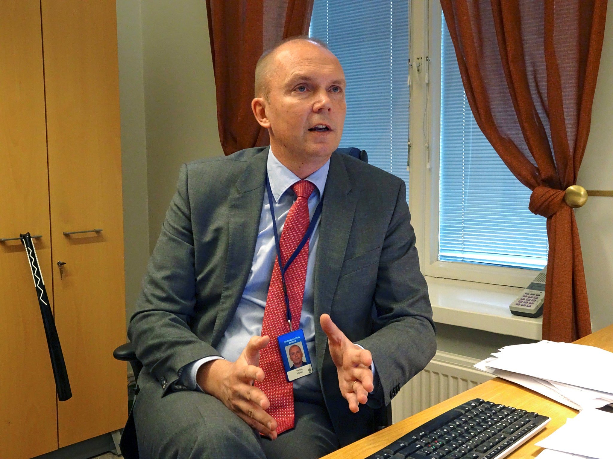 Head of the Finnish government's communication department Markku Mantila speaks at his office in Helsinki
