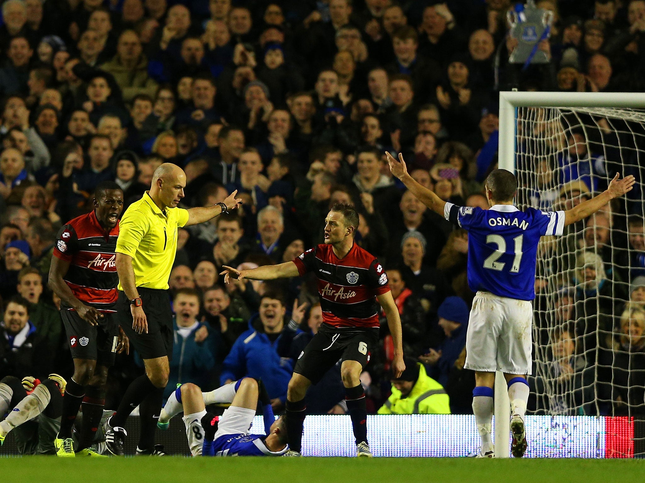 QPR'S Clint Hill appeals to Howard Webb after the the referee had awarded a penalty to Everton during a FA Cup Third Round match between the two sides at Goodison Park on January 4, 2014