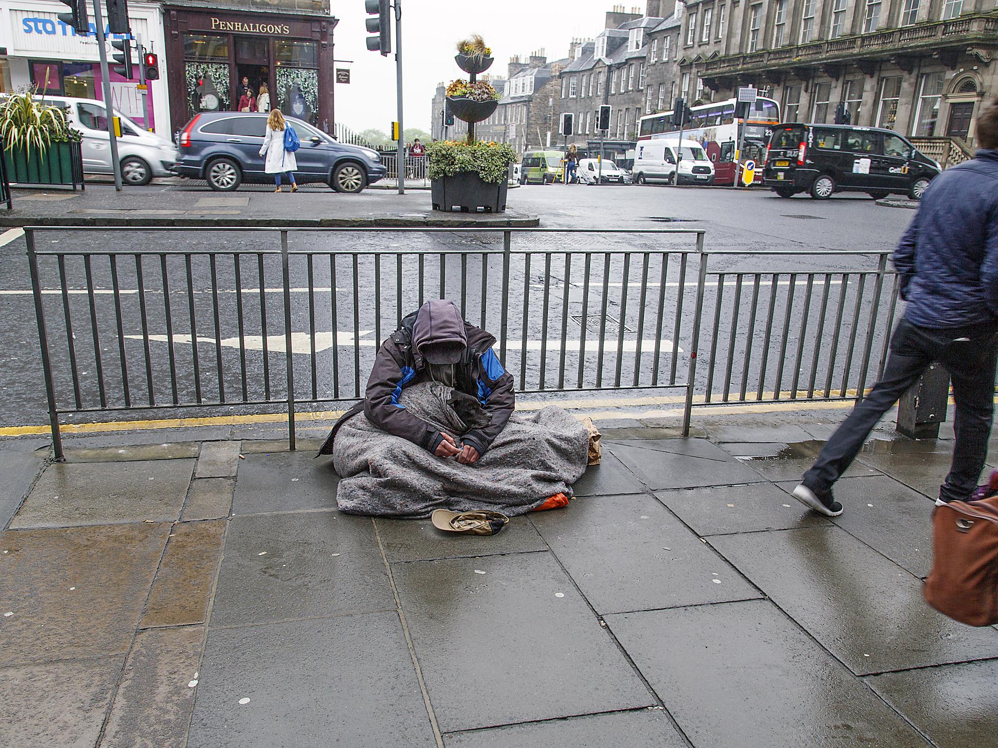 A beggar in Edinburgh city centre. Most local authorities discourage people from giving money to those on the street, and instead advise donating to homeless charities