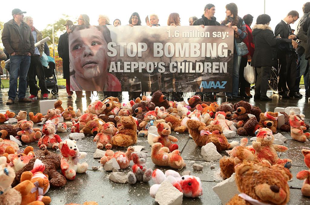Bloodied teddy bears are seen during a demonstration against Russian military operations in Syria during a visit by Russian President Vladimir Putin to the German federal Chancellery on October 19, 2016 in Berlin, Germany.