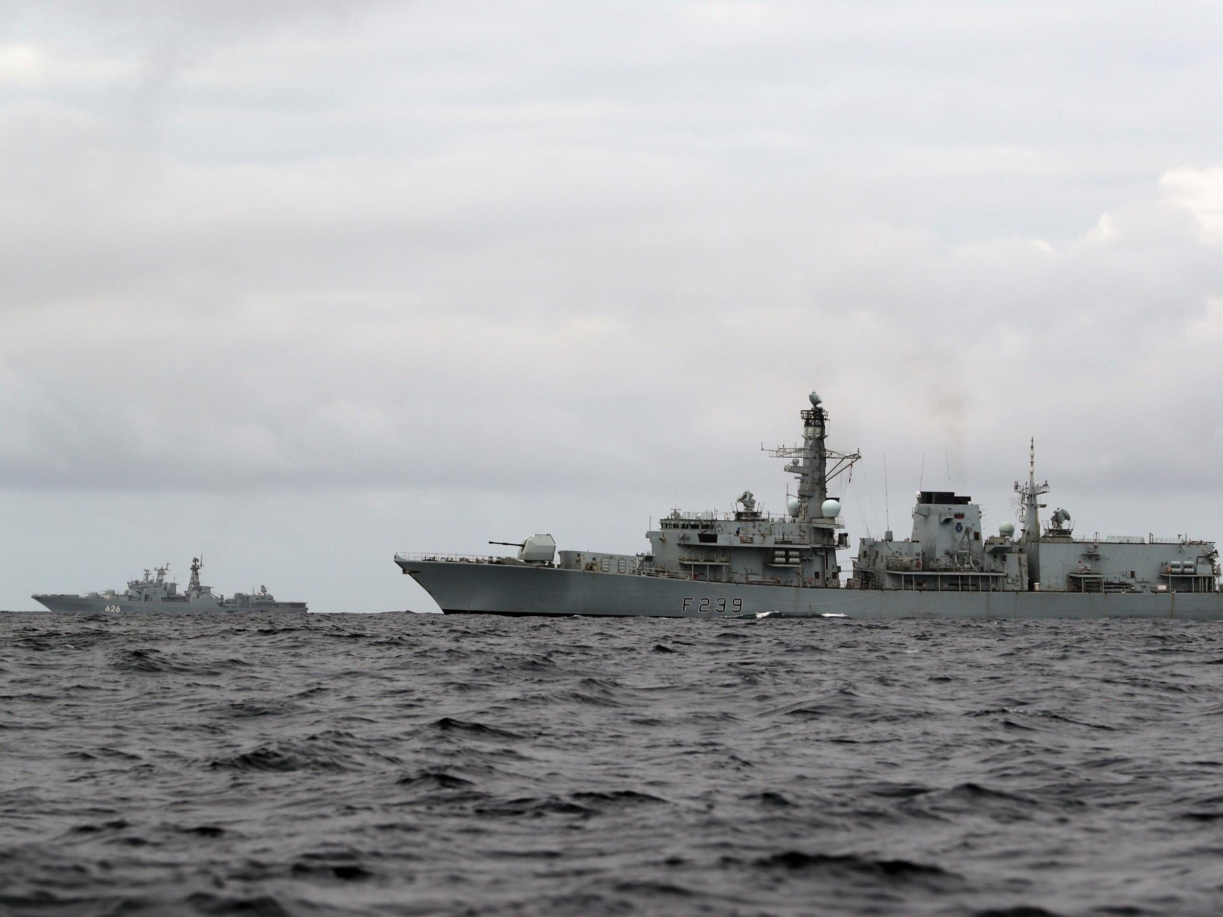 HMS Richmond (right) escorts Russian aircraft carrier vessel Admiral Kuznetsov (left)