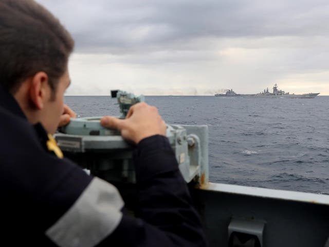 A Royal Navy lookout observes Russian aircraft carrier Admiral Kuznetsov