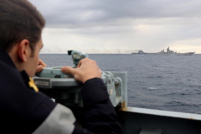 A Royal Navy lookout observes Russian aircraft carrier Admiral Kuznetsov
