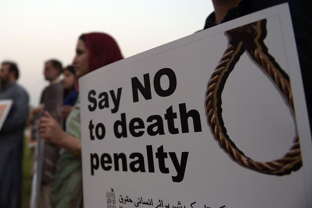 Activists from the Human Rights Commission of Pakistan (HRCP) carry placards during a demonstration to mark International Day Against the Death Penalty in Islamabad on October 10, 2015