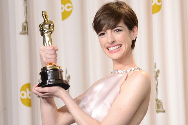 Anne Hathaway with her Oscar in 2013